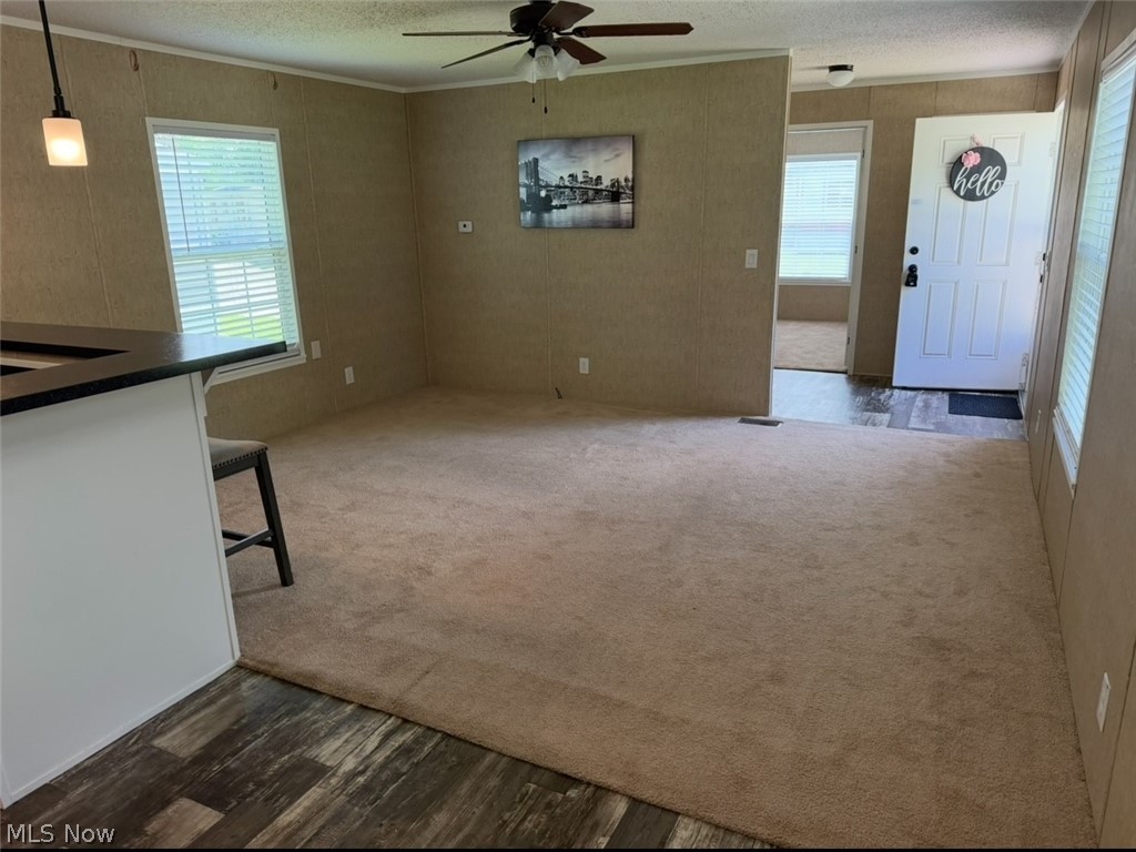 202 West Main Road, Unit 139 Conneaut, OH 44030 - Photo 43 of 45 Spacious interior featuring a combination of wood-finish flooring and neutral carpeting