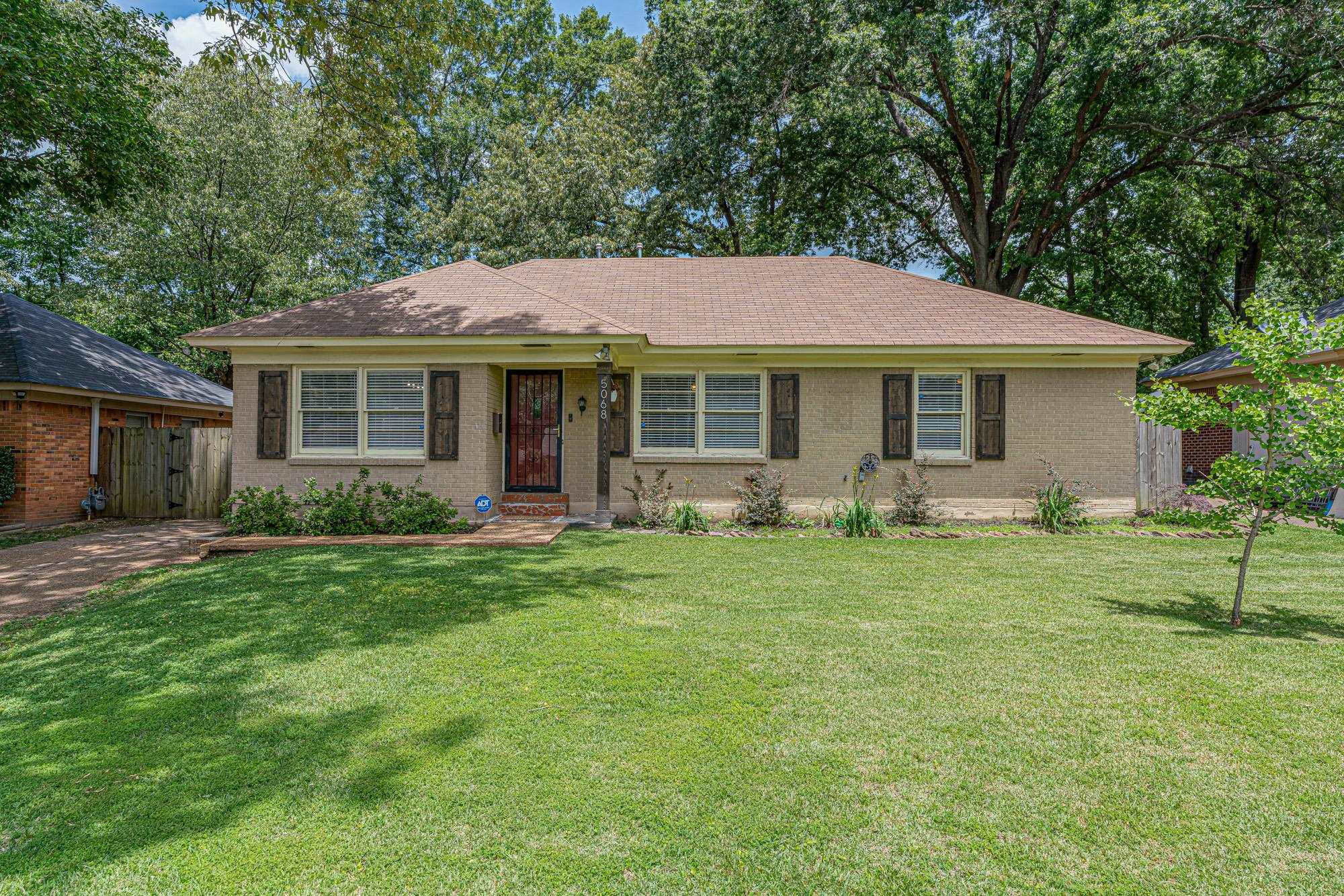5068 Wingdale Road Memphis, TN 38117 - Photo 1 of 21 a front view of house with yard and green space