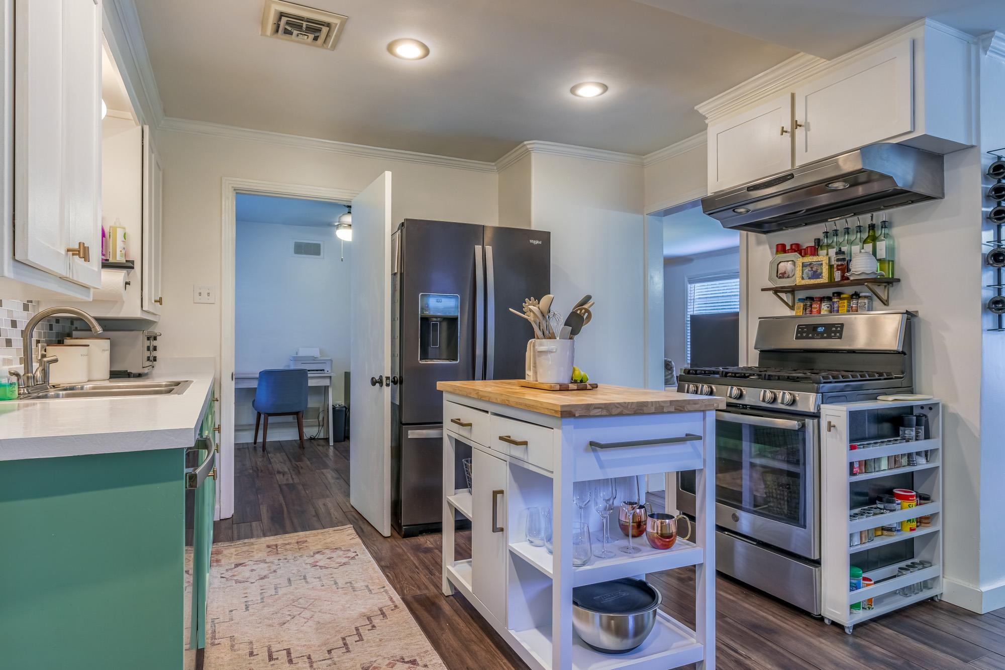 5068 Wingdale Road Memphis, TN 38117 - Photo 10 of 21 a kitchen with stainless steel appliances granite countertop a stove and a refrigerator