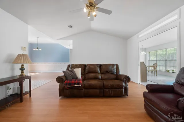 a room with a bed and a chandelier