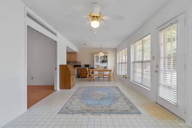 a dining room with furniture and window