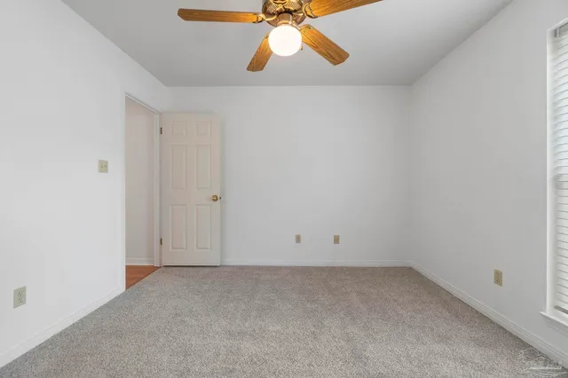a bathroom with a tub shower and sink