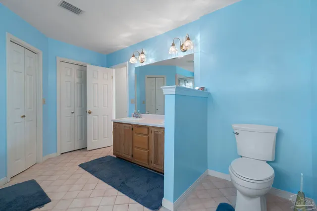 a room with a sink and a mirror