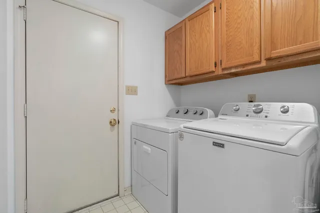 a view of a patio with table and chairs with wooden floor and fence