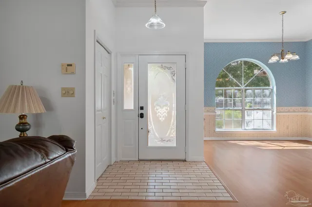 a view of empty room with a large window