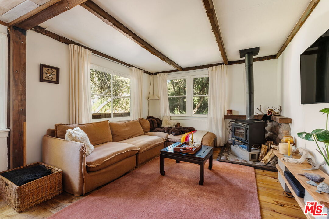 23300 Red Rock Road Topanga, CA 90290 - Photo 11 of 59 a living room with furniture and a flat screen tv