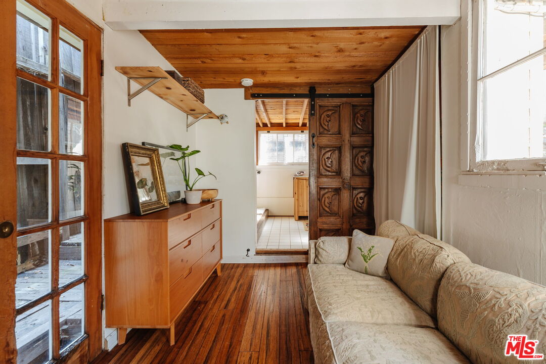 23300 Red Rock Road Topanga, CA 90290 - Photo 16 of 59 a living room with furniture and a wooden floor
