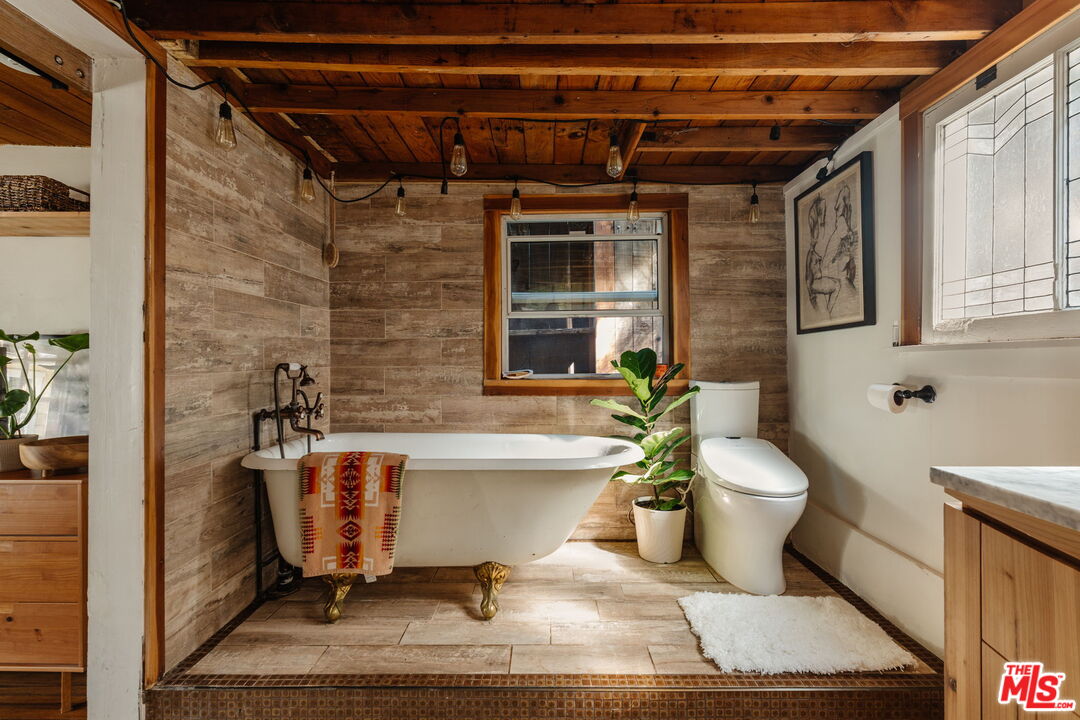23300 Red Rock Road Topanga, CA 90290 - Photo 18 of 59 a view of a bathtub in a bathroom