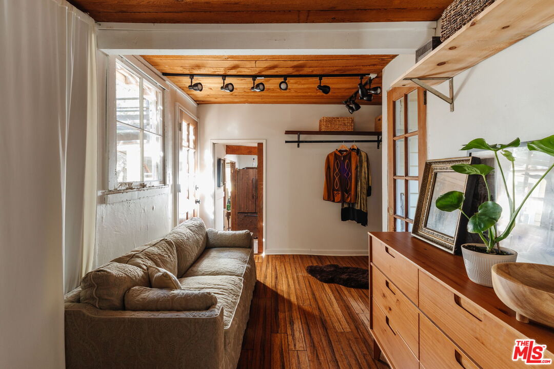 23300 Red Rock Road Topanga, CA 90290 - Photo 19 of 59 a living room with furniture and a large window
