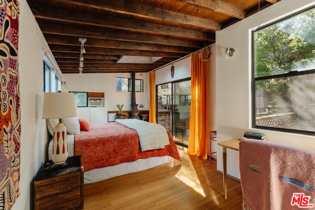 23300 Red Rock Road Topanga, CA 90290 - Photo 20 of 59 a bed room with a bed and a window