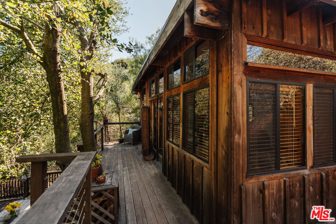 23300 Red Rock Road Topanga, CA 90290 - Photo 36 of 59 a view of a house with backyard and wooden fence