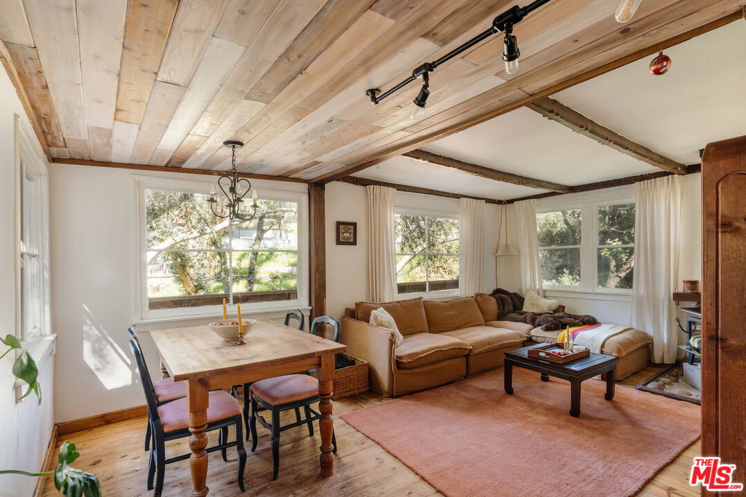 23300 Red Rock Road Topanga, CA 90290 - Photo 4 of 59 a living room with furniture and a large window