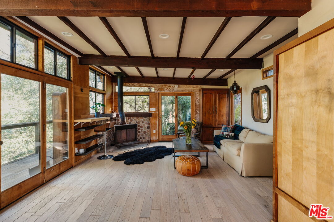 23300 Red Rock Road Topanga, CA 90290 - Photo 41 of 59 a living room with furniture and a large window