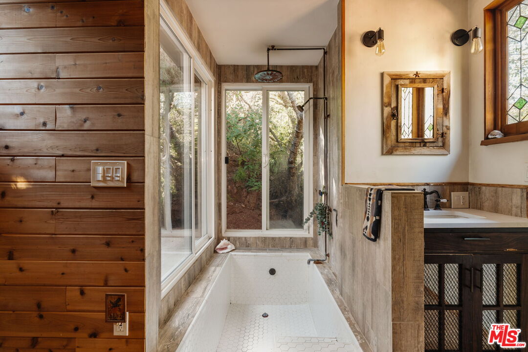 23300 Red Rock Road Topanga, CA 90290 - Photo 45 of 59 a bathroom with a bathtub and a shower