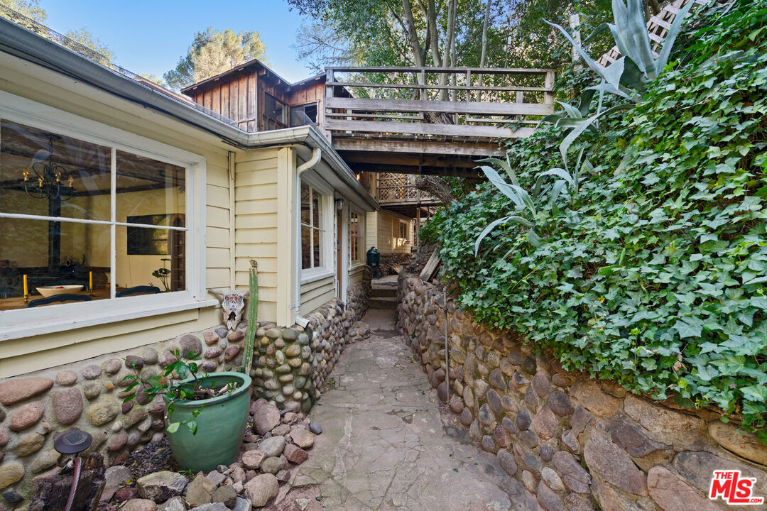 23300 Red Rock Road Topanga, CA 90290 - Photo 54 of 59 a view of a house with a flower garden