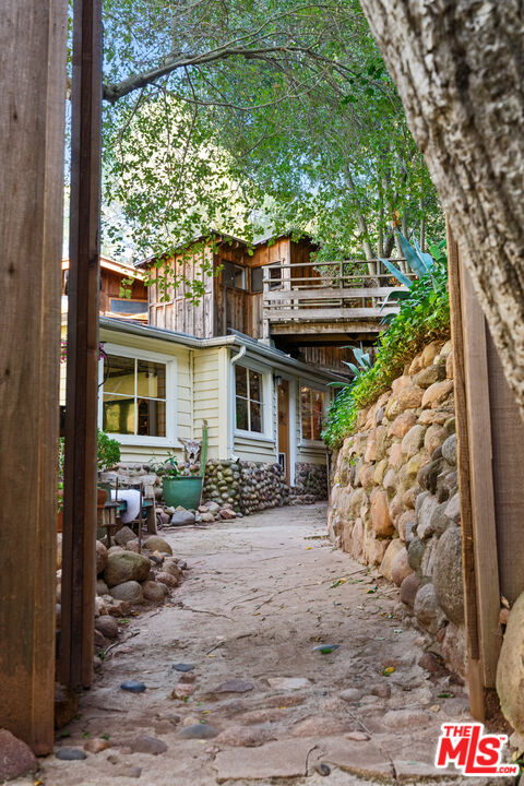 23300 Red Rock Road Topanga, CA 90290 - Photo 55 of 59 a front view of a house with garden