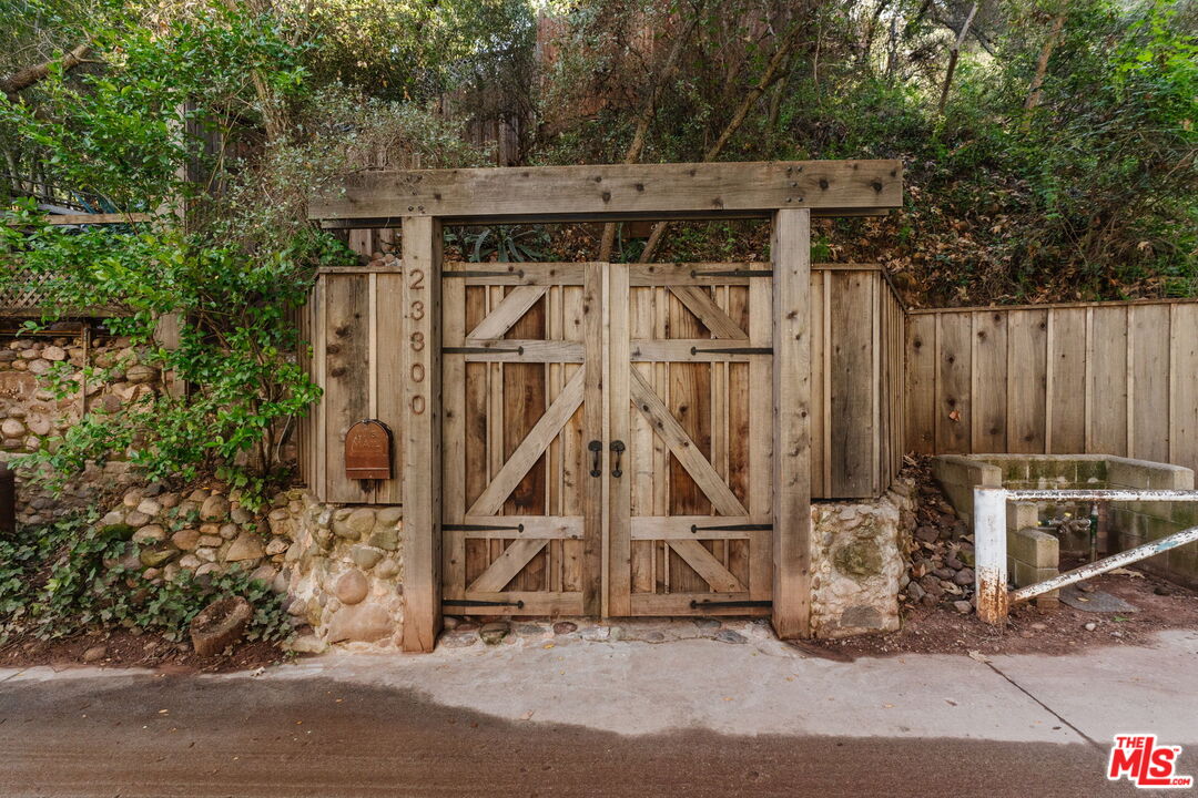 23300 Red Rock Road Topanga, CA 90290 - Photo 56 of 59 a view of a chairs and table on the wooden floor