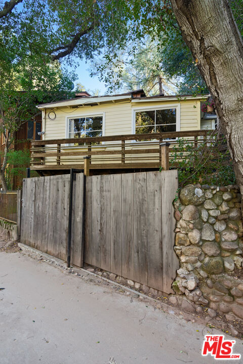 23300 Red Rock Road Topanga, CA 90290 - Photo 59 of 59 a view of a house with wooden fence