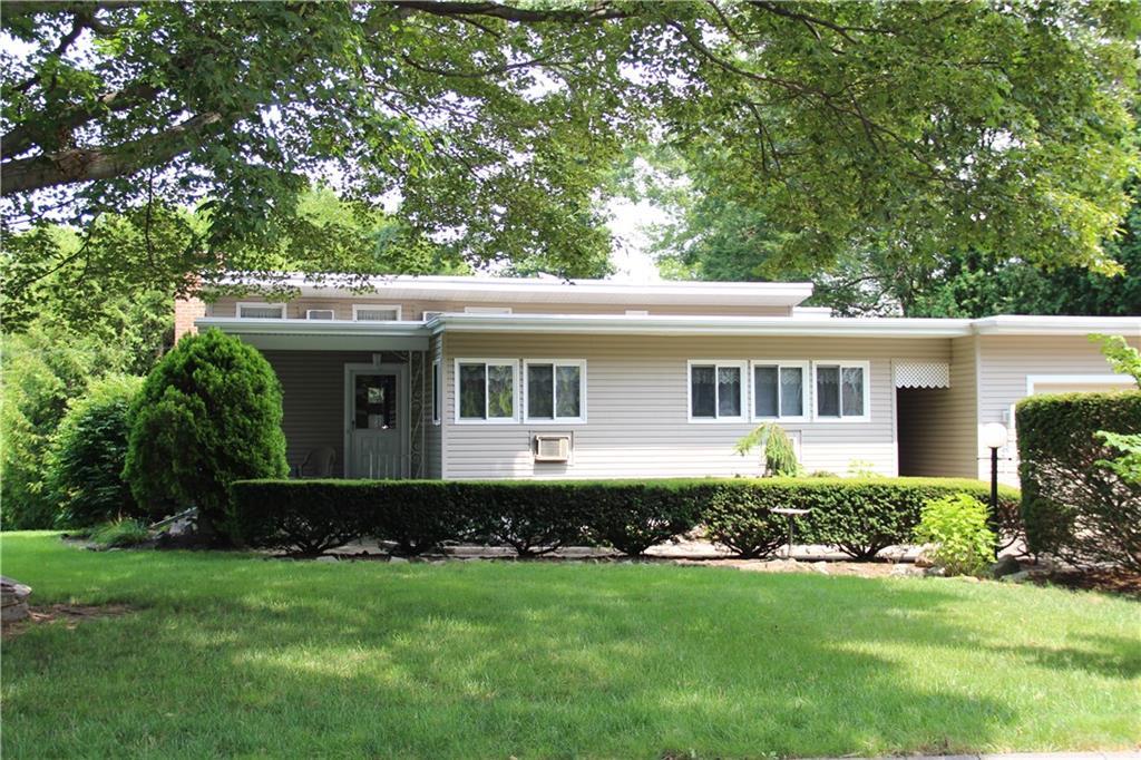 385 Grandview Road Fairfield, CT 06825 - Photo 1 of 1 a front view of a house with a garden