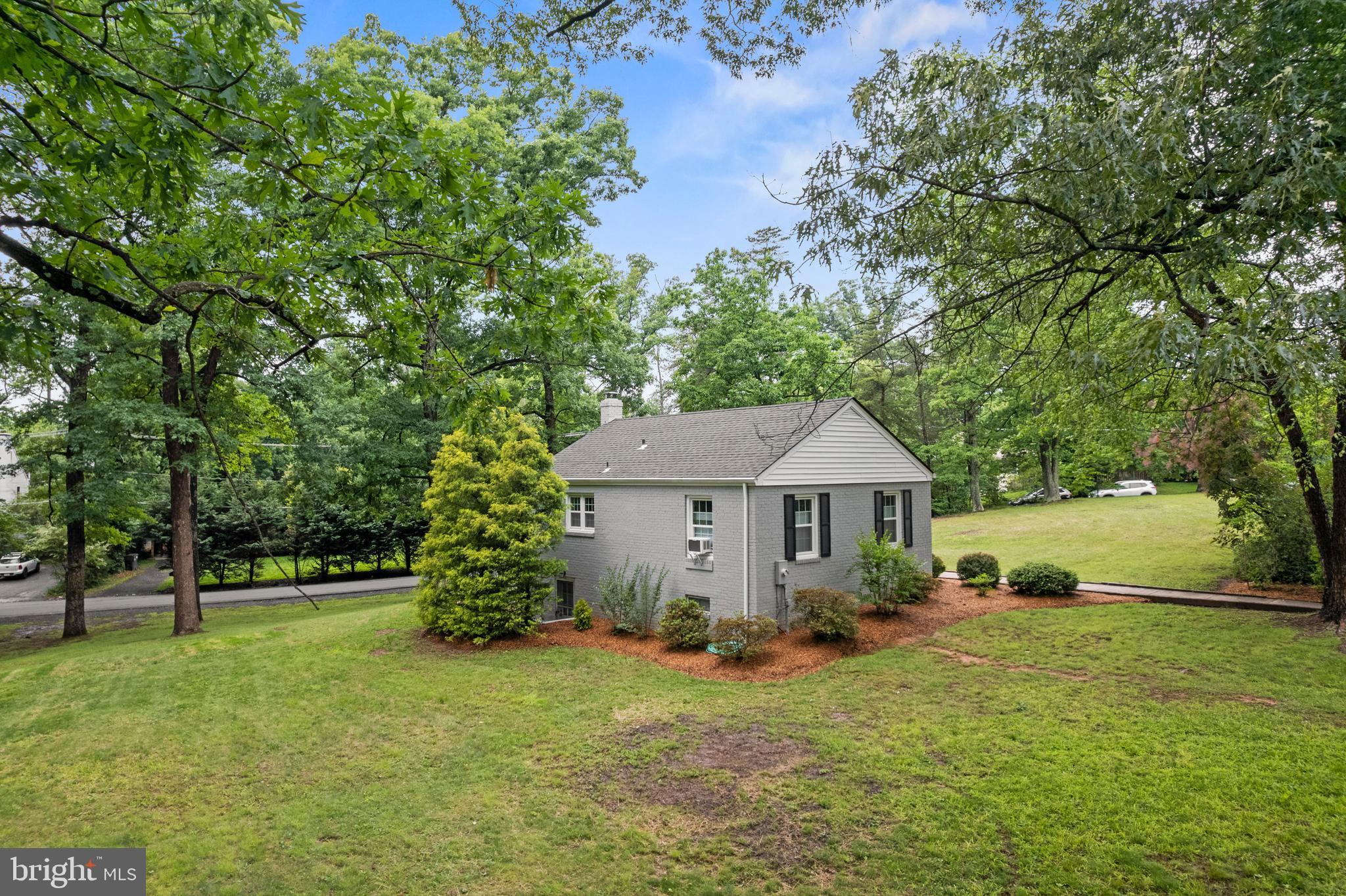 12131 Waples Mill Road Oakton, VA 22124 - Photo 30 of 40 a view of a house with a back yard