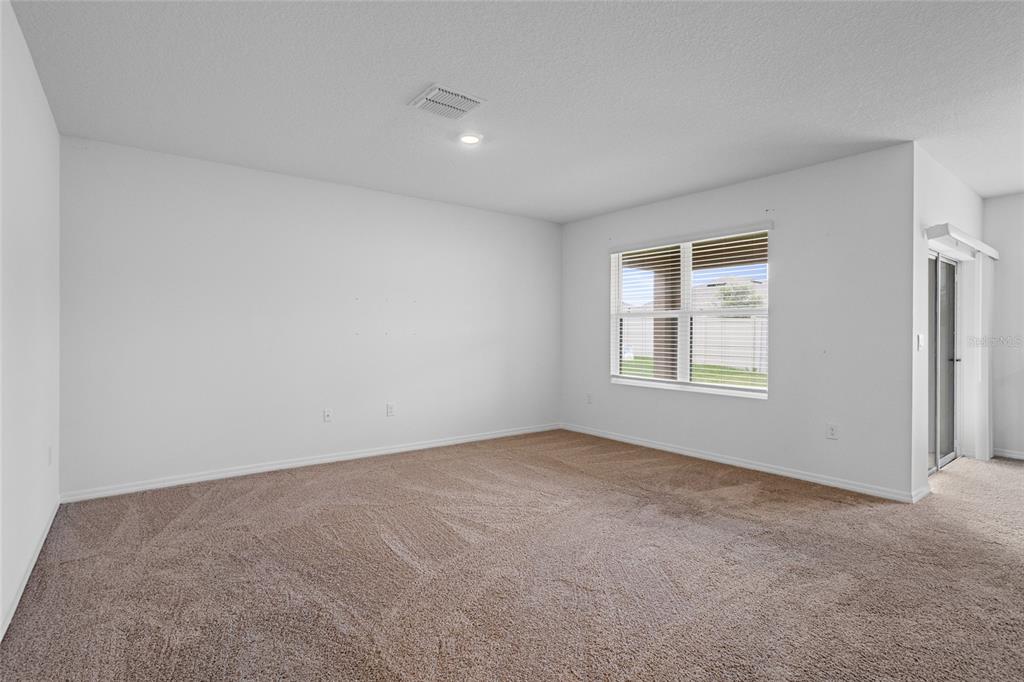 2143 Kalin Way Tavares, FL 32778 - Photo 14 of 37 an empty room with windows