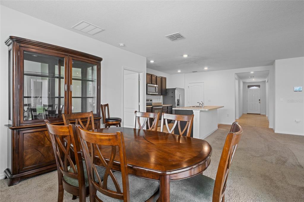 2143 Kalin Way Tavares, FL 32778 - Photo 19 of 37 a dining room with furniture and window