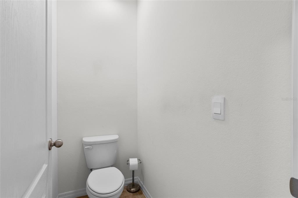 2143 Kalin Way Tavares, FL 32778 - Photo 28 of 37 a white toilet sitting next to a white wall