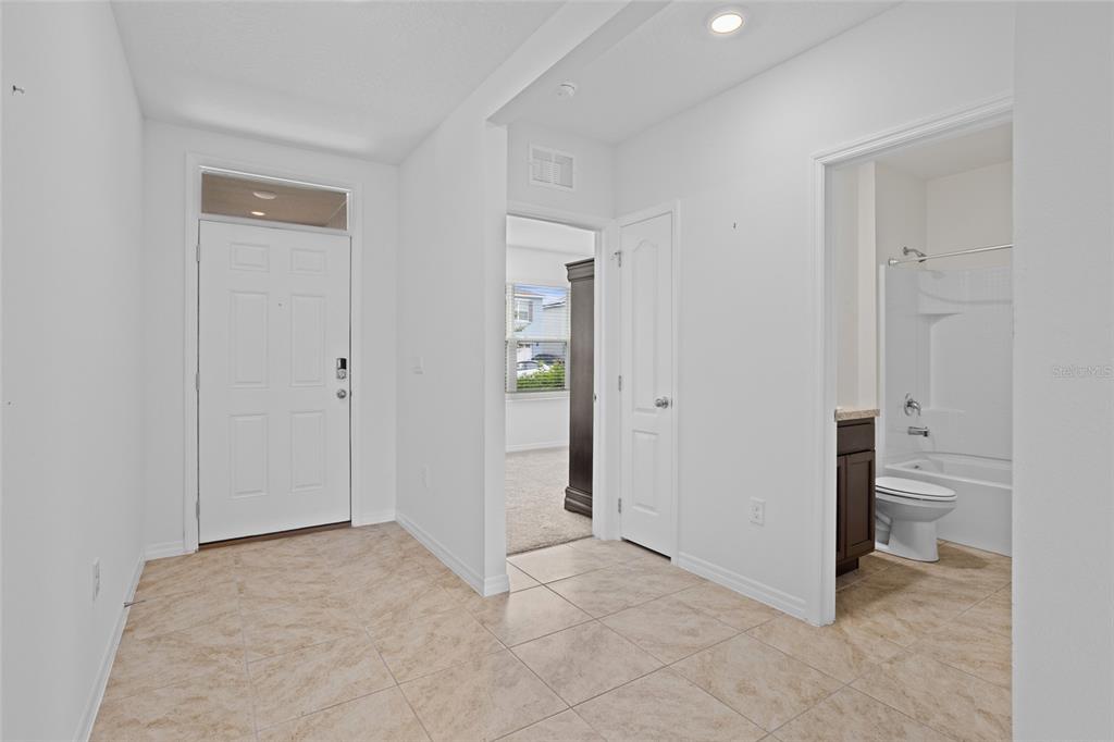 2143 Kalin Way Tavares, FL 32778 - Photo 5 of 37 an empty room with closet and a bathroom