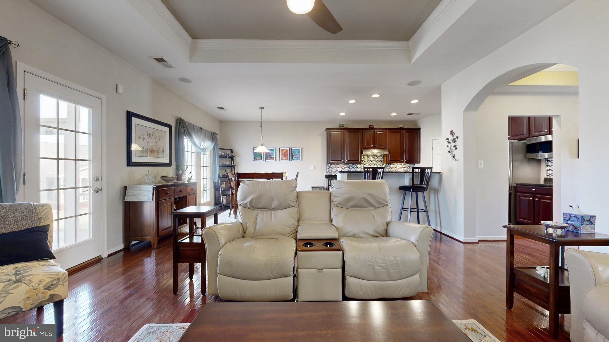 546 Stonehaven Drive Townsend, DE 19734 - Photo 17 of 60 a living room with furniture and a flat screen tv