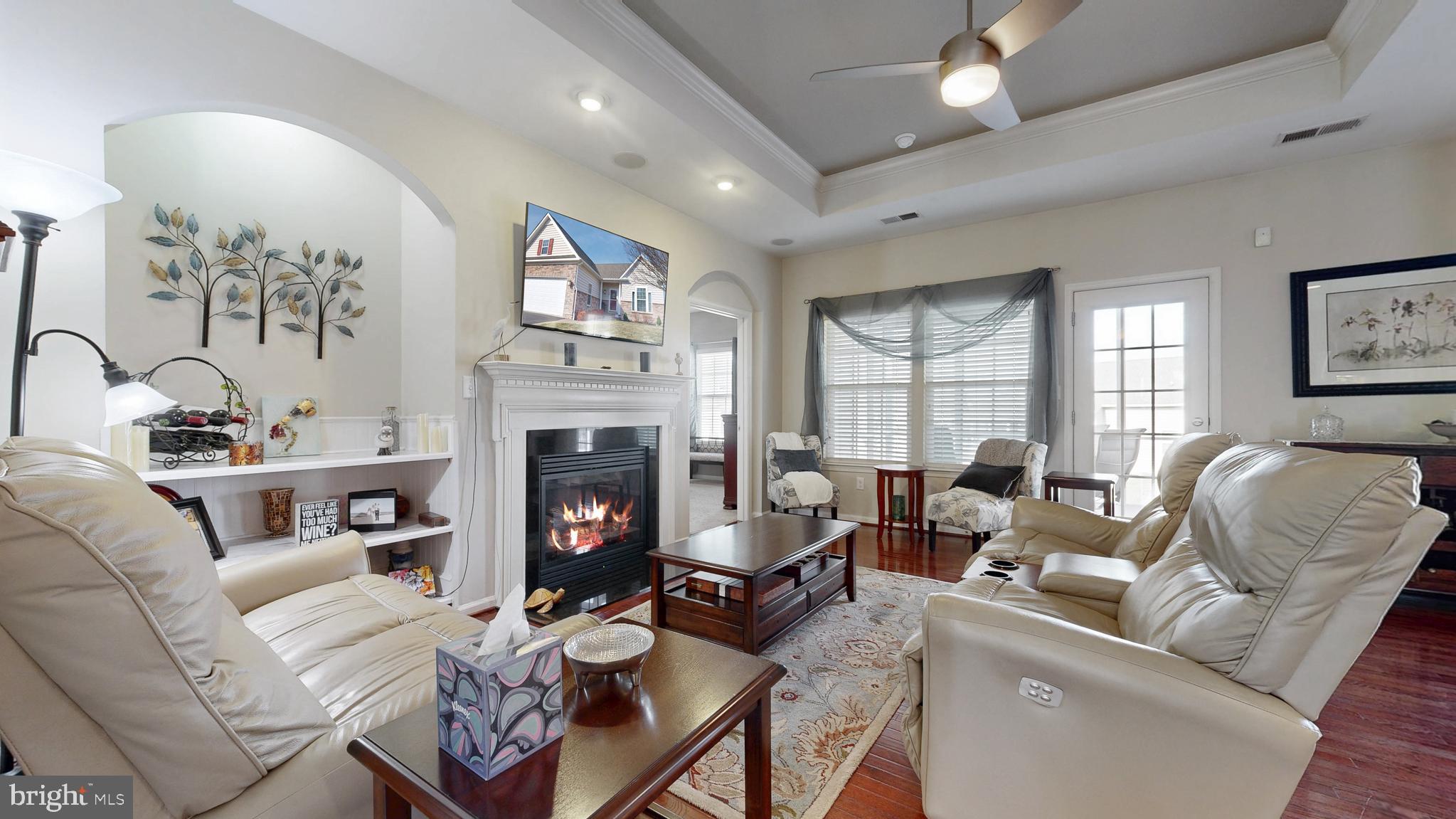 546 Stonehaven Drive Townsend, DE 19734 - Photo 20 of 60 a living room with furniture fireplace and a large window
