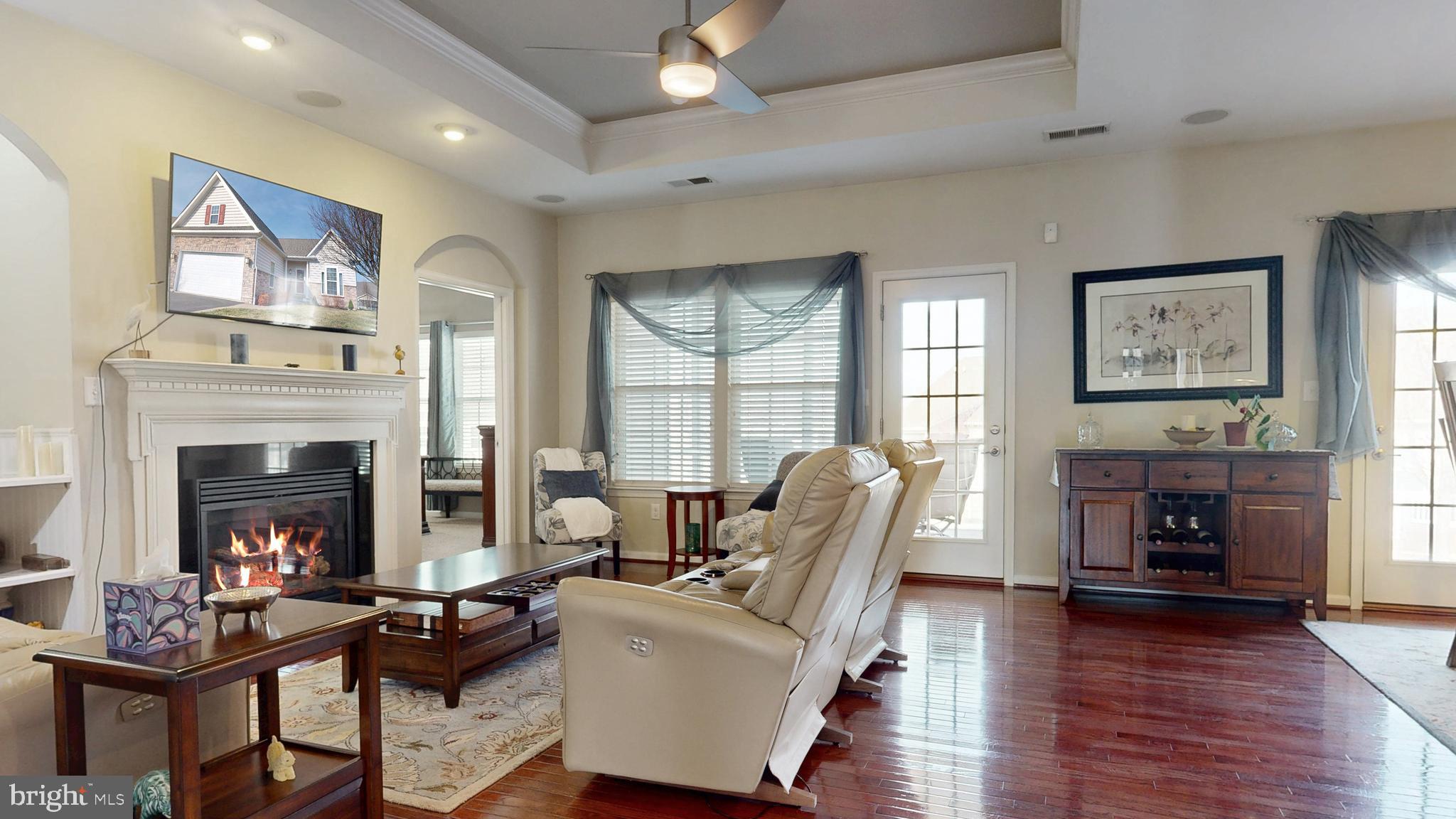546 Stonehaven Drive Townsend, DE 19734 - Photo 21 of 60 a living room with furniture and a fireplace