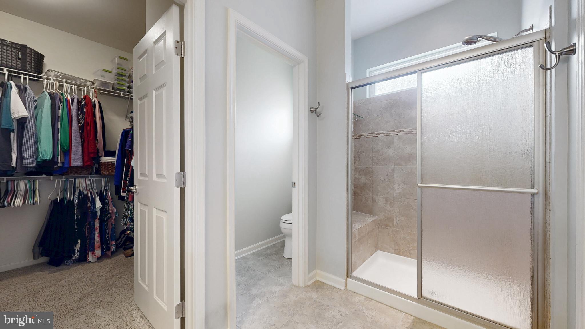 546 Stonehaven Drive Townsend, DE 19734 - Photo 30 of 60 a view of walk in closet with clothes