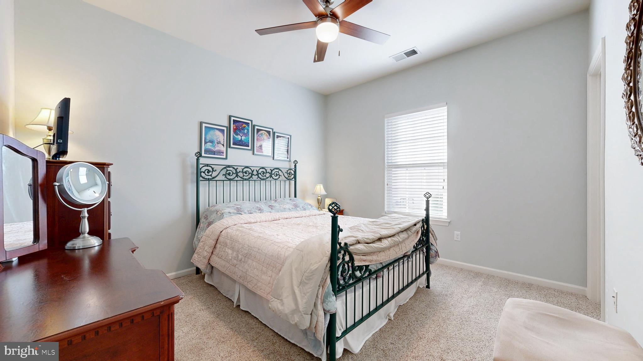 546 Stonehaven Drive Townsend, DE 19734 - Photo 31 of 60 a bedroom with bed and a window