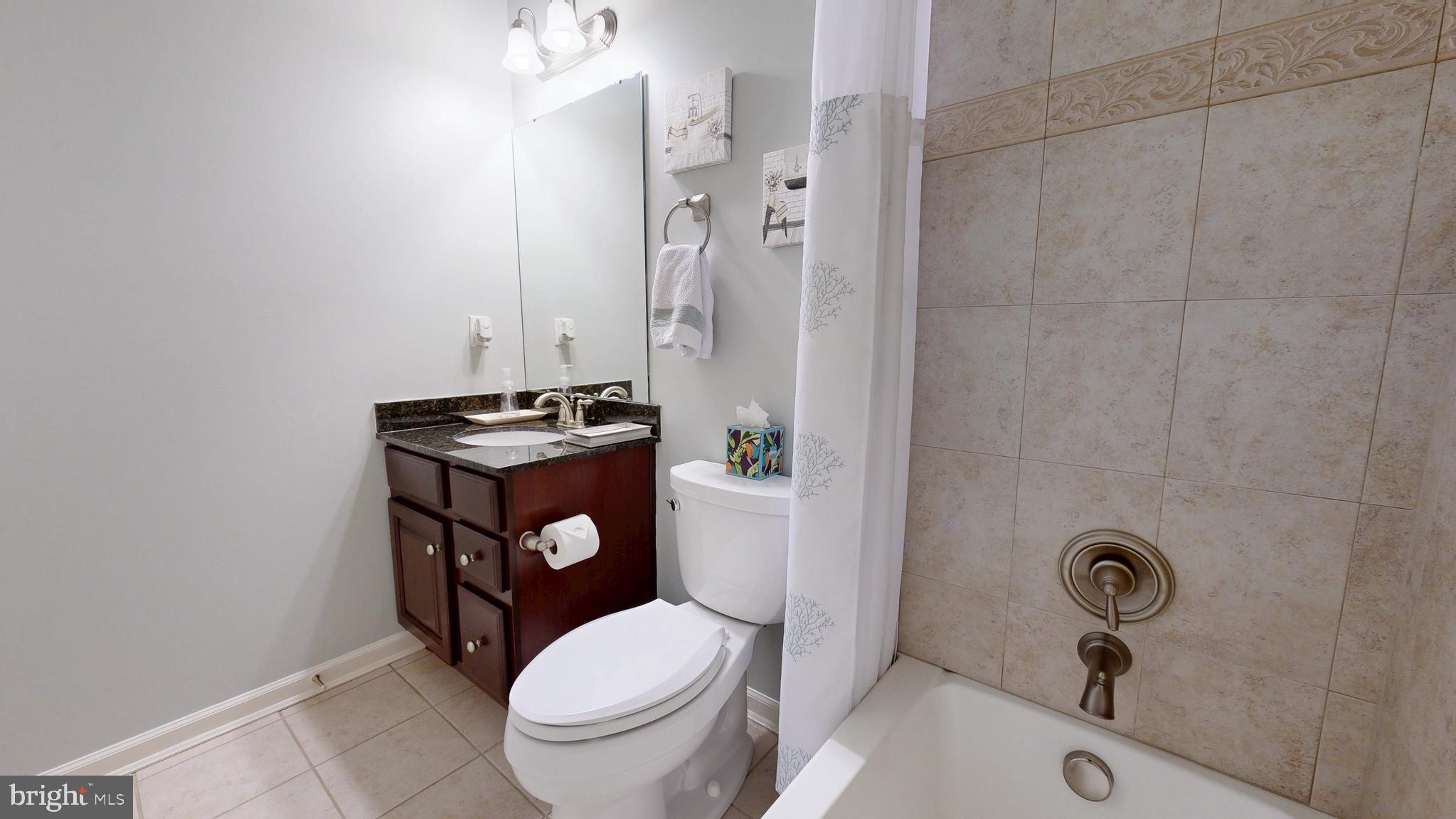 546 Stonehaven Drive Townsend, DE 19734 - Photo 35 of 60 a bathroom with a toilet a sink and a shower
