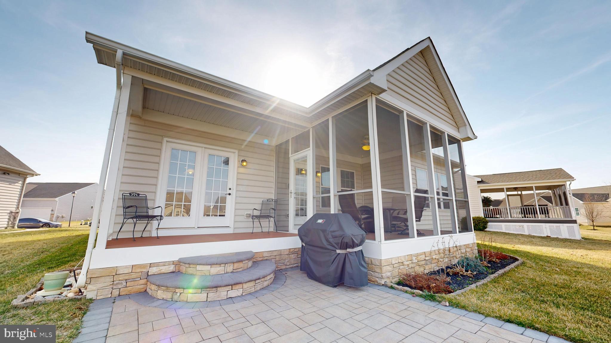 546 Stonehaven Drive Townsend, DE 19734 - Photo 43 of 60 a front view of a house with swimming pool and sitting area