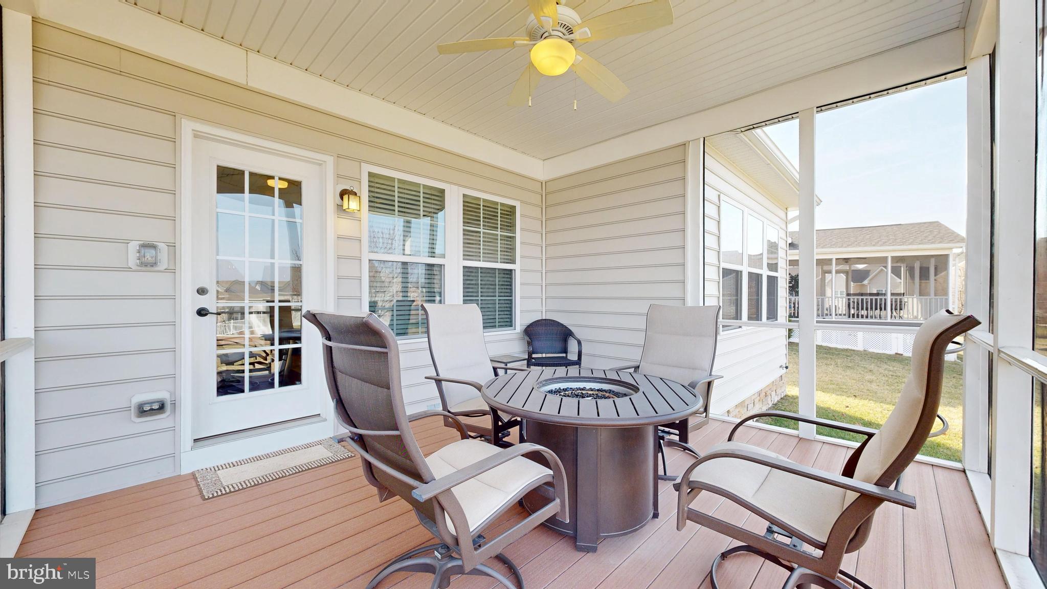 546 Stonehaven Drive Townsend, DE 19734 - Photo 46 of 60 a view of a dining room with furniture window and wooden floor