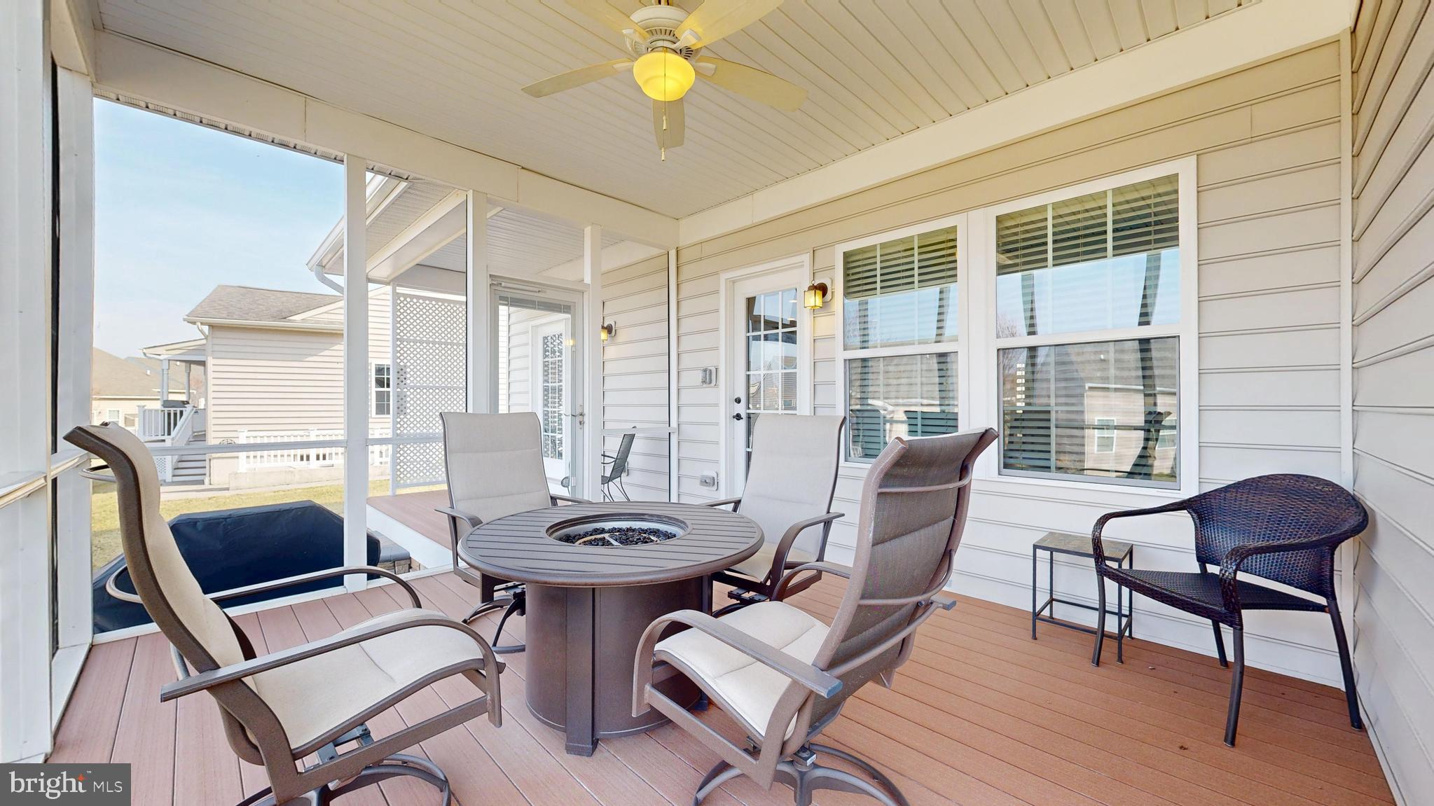 546 Stonehaven Drive Townsend, DE 19734 - Photo 47 of 60 a view of a dining room with furniture and wooden floor