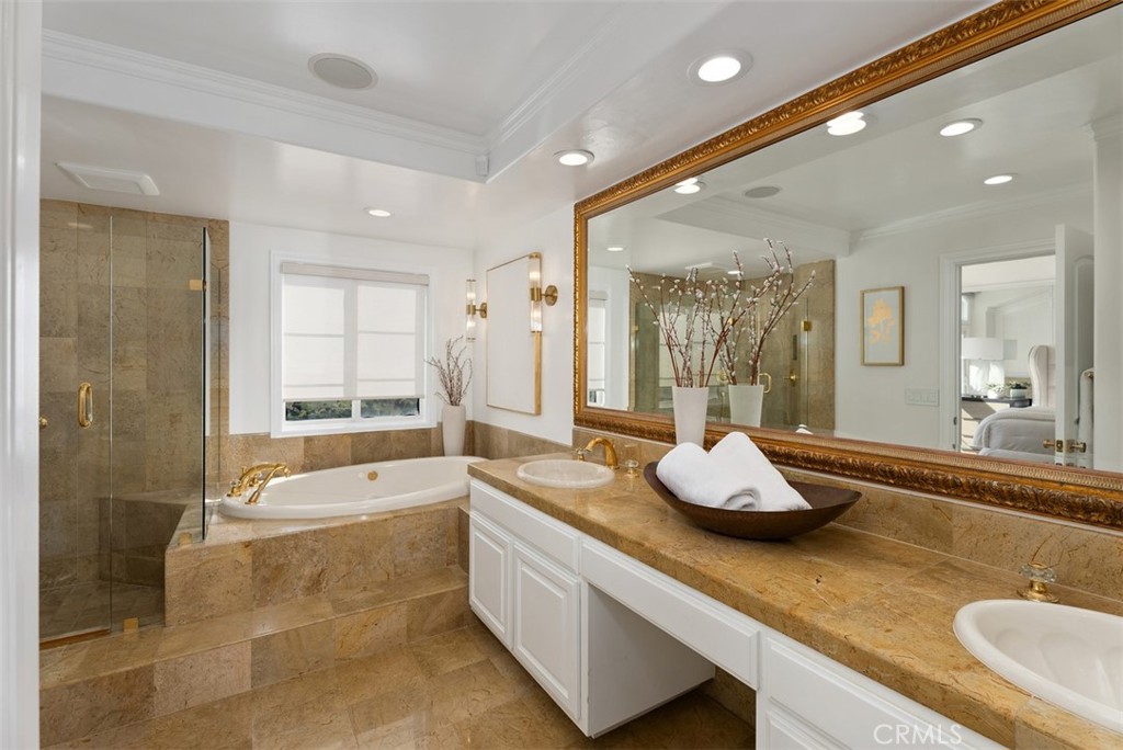 74 Chandon Newport Coast, CA 92657 - Photo 15 of 27 a bathroom with a granite countertop tub sink and mirror