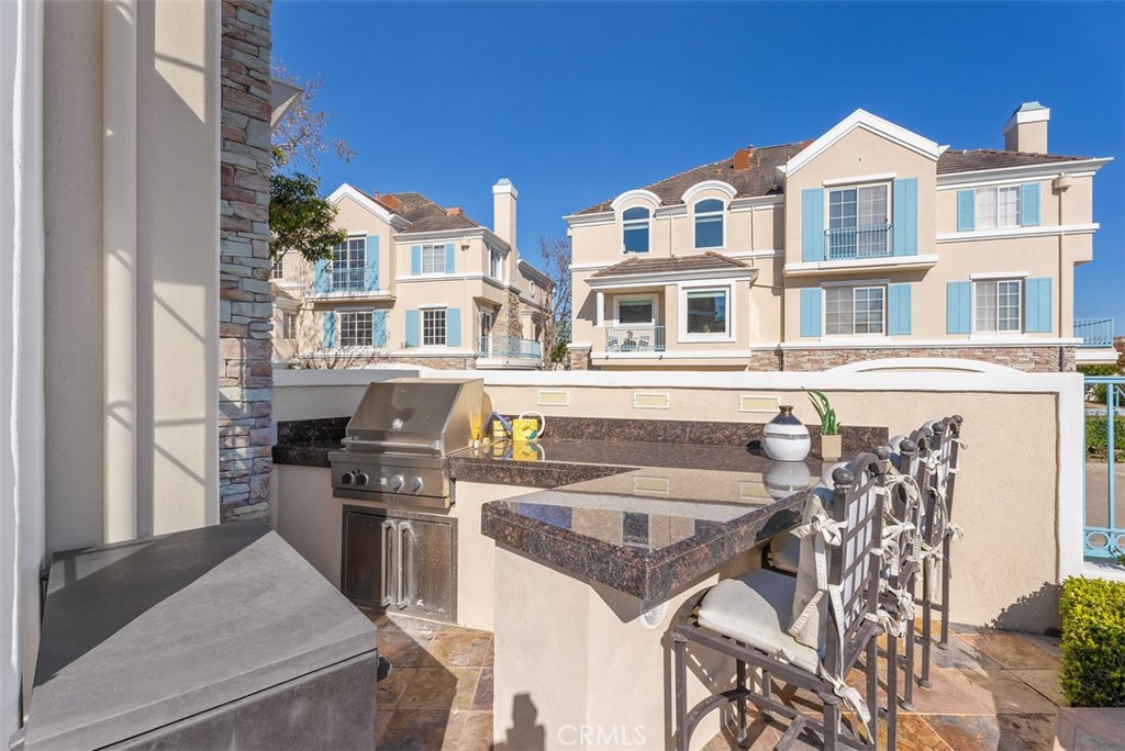 74 Chandon Newport Coast, CA 92657 - Photo 21 of 27 a front view of a building with glass windows
