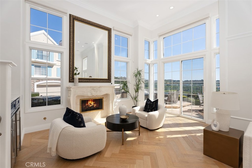 74 Chandon Newport Coast, CA 92657 - Photo 5 of 27 a living room with furniture large window and fireplace