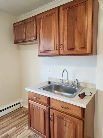 a kitchen with stainless steel appliances granite countertop a sink and cabinets