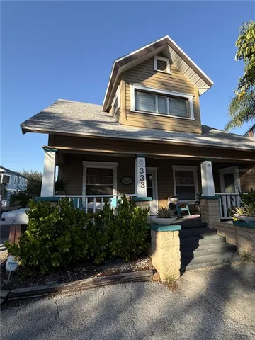 a front view of a house with garage