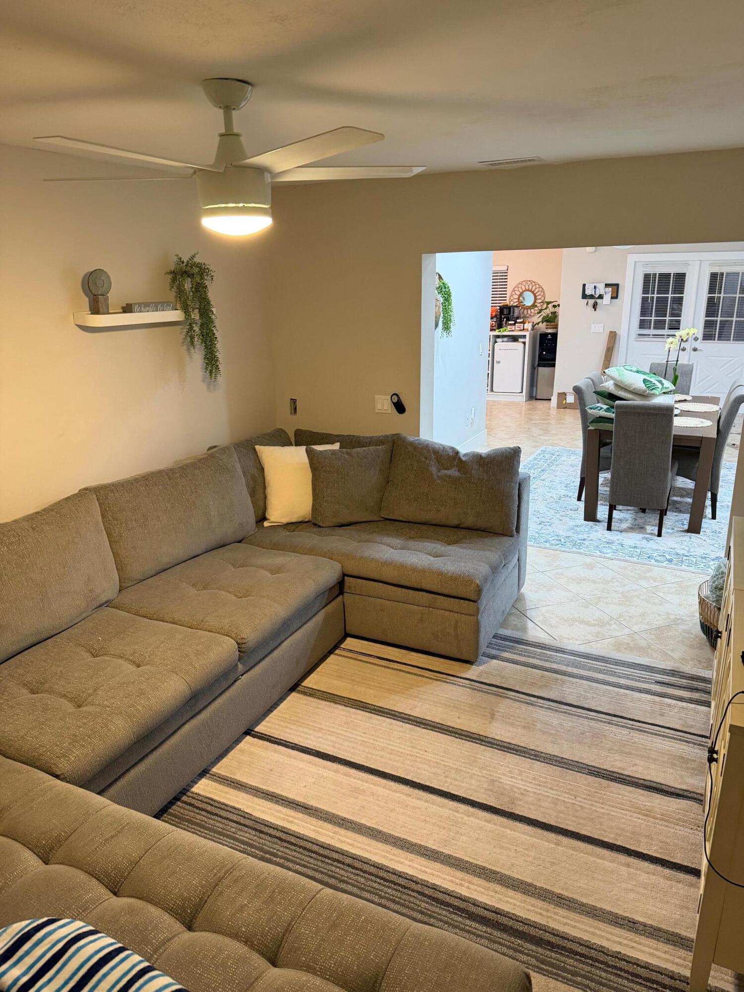 9675 Southwest 1st Place Boca Raton, FL 33428 - Photo 11 of 11 a living room with furniture and a couch