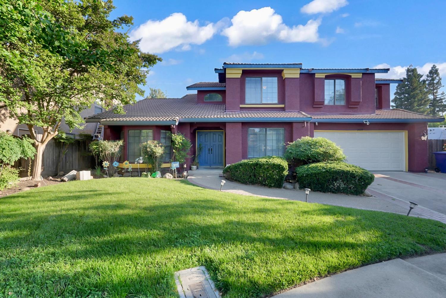 2809 Fleming Court Modesto, CA 95356 - Photo 1 of 34 a front view of a house with a yard table and chairs