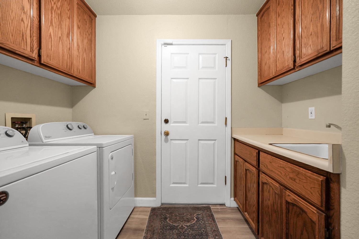 2809 Fleming Court Modesto, CA 95356 - Photo 13 of 34 a utility room with dryer and washer
