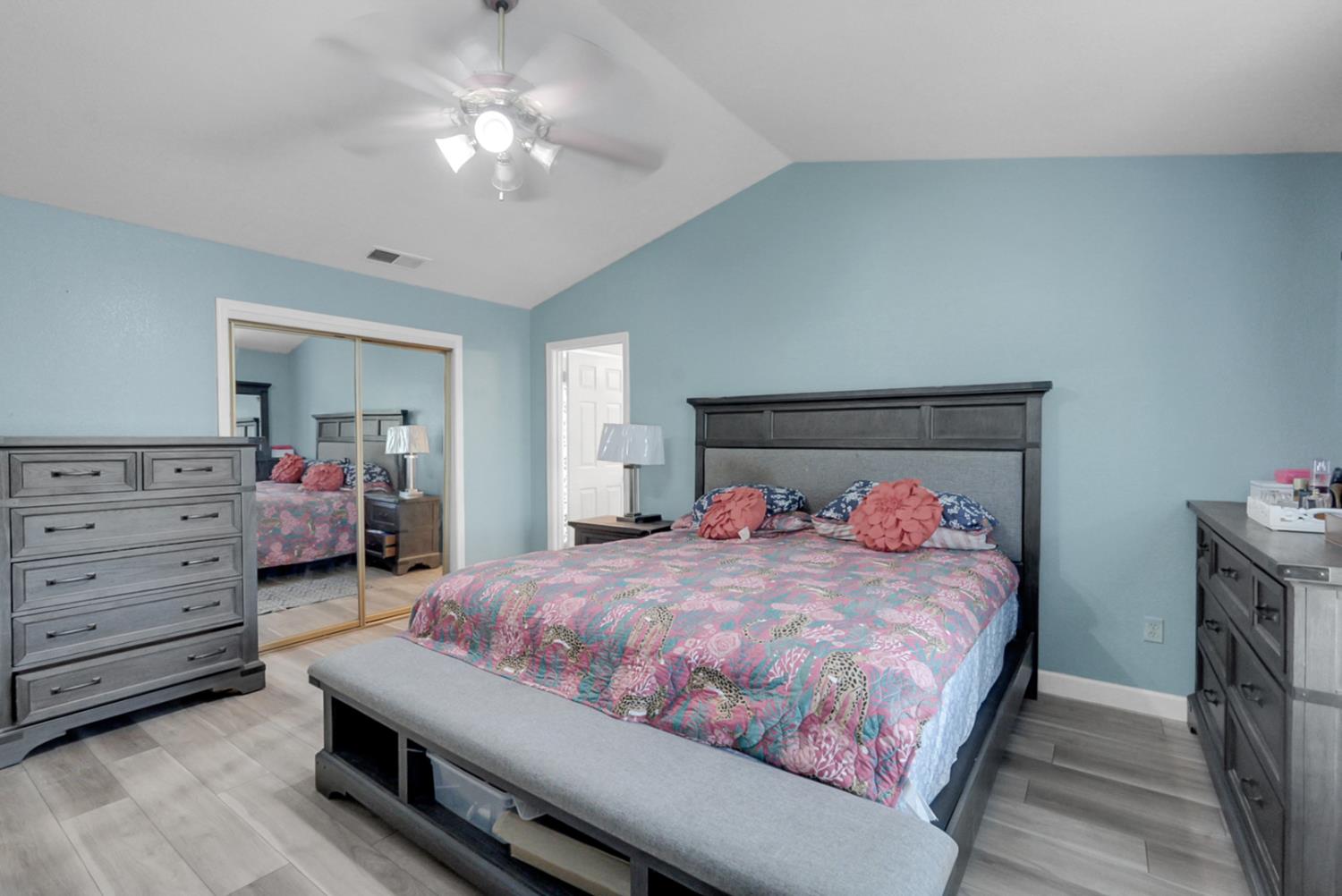 2809 Fleming Court Modesto, CA 95356 - Photo 20 of 34 a bedroom with a bed and a chandelier