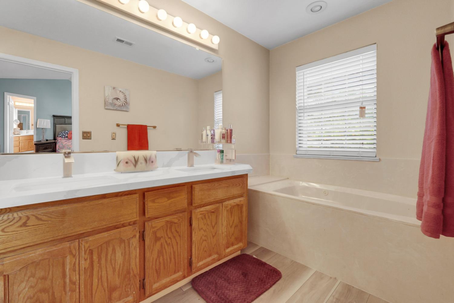 2809 Fleming Court Modesto, CA 95356 - Photo 22 of 34 a bathroom with a tub sink and mirror
