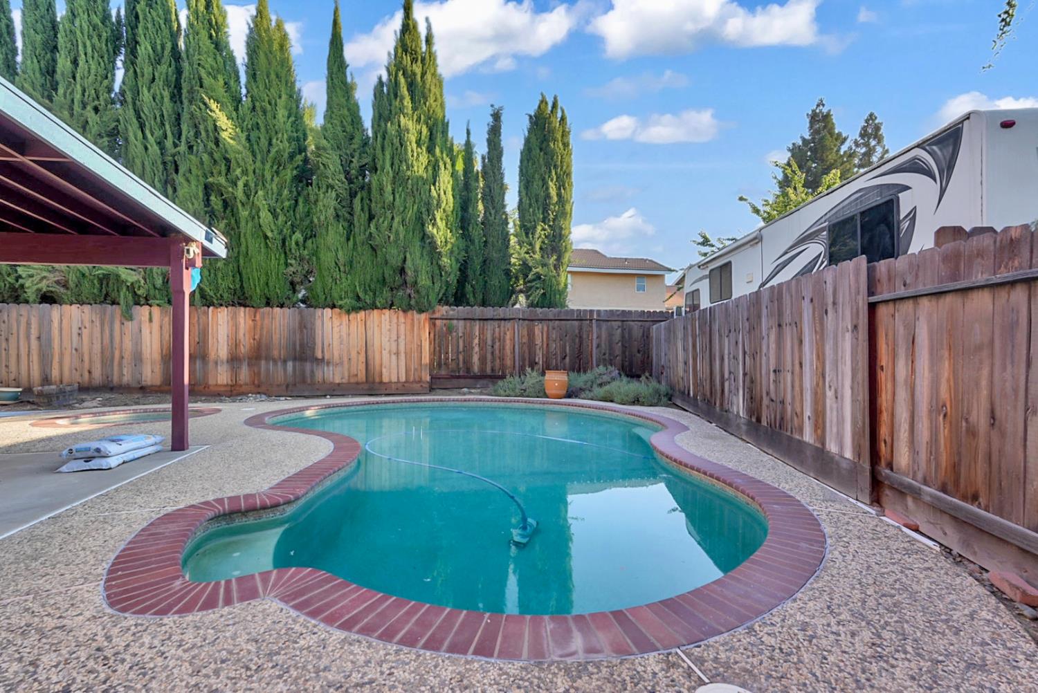 2809 Fleming Court Modesto, CA 95356 - Photo 26 of 34 a view of a backyard with a swimming pool