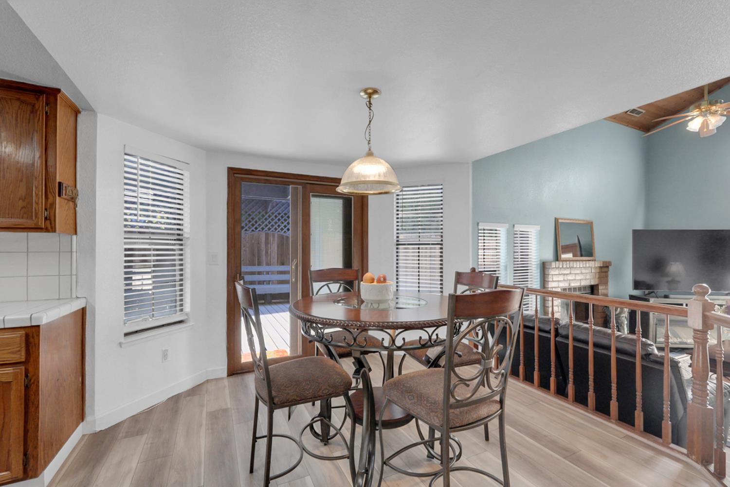 2809 Fleming Court Modesto, CA 95356 - Photo 7 of 34 a view of a dining room with furniture window and wooden floor