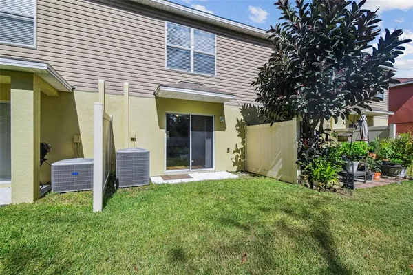 a view of a house with a small yard and plants